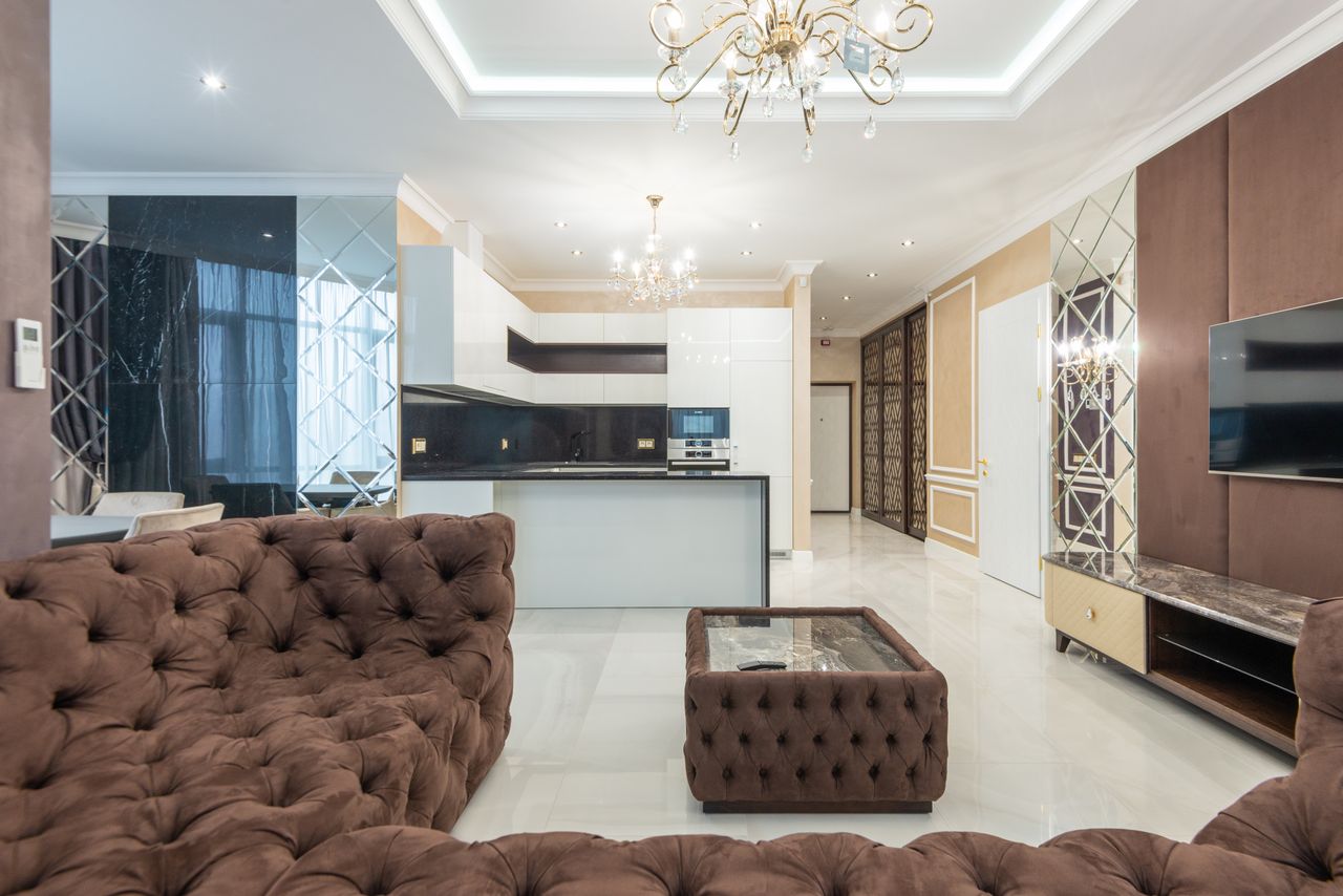 Stylish interior of a modern living room featuring plush furniture and elegant lighting.